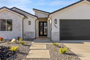 Entrance to property featuring a garage