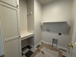 Washroom featuring laundry area, hookup for a washing machine, baseboards, and hookup for an electric dryer