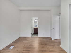 Unfurnished room featuring hardwood / wood-style floors