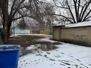 View of yard covered in snow