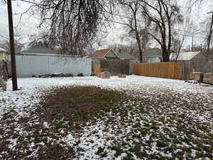 View of yard layered in snow