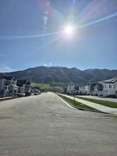 Property view of mountains with a residential view