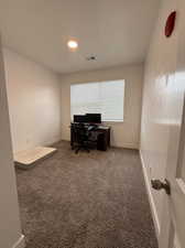 Home office with carpet flooring