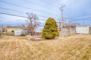 View of yard with a shed