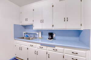 Kitchen with sink and white cabinets