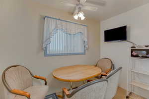 Dining room featuring ceiling fan