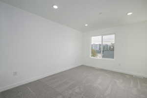 Empty room with carpet floors