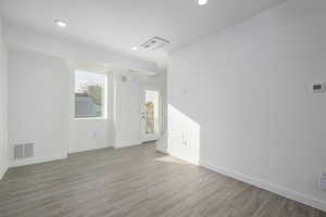 Empty room featuring light hardwood / wood-style flooring