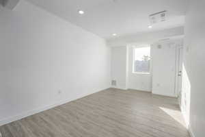 Unfurnished room featuring light hardwood / wood-style floors