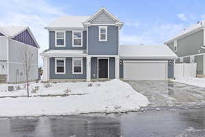 View of front property featuring a garage