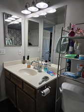 Bathroom featuring vanity and toilet