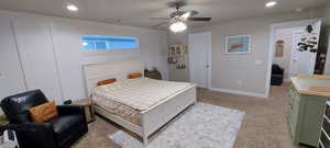 Carpeted bedroom with ceiling fan