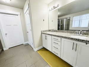 Bathroom with an enclosed shower and vanity