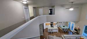 Interior space featuring ceiling fan and wood-type flooring