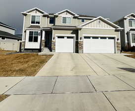 Craftsman inspired home with a garage