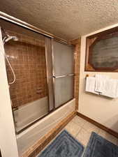 Primary bathroom with bath / shower combo