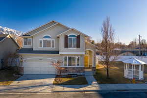 View of front property featuring a garage and a mountain view