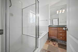 Primary bathroom with vanity and plus walk in shower