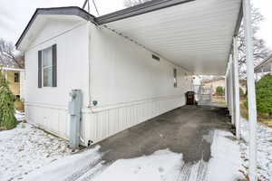 2 Car Carport featuring custom metal stairs and platform.