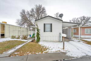 View of front of home featuring a carport