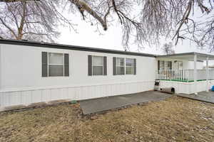 View of home's exterior featuring covered deck