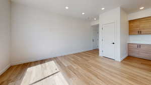 Unfurnished bedroom with light wood-type flooring