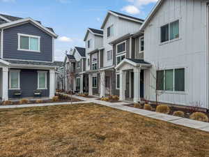 View of front of property with a front yard