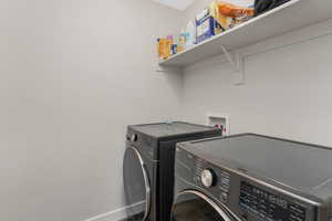 Clothes washing area with washer and clothes dryer