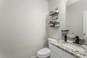 Bathroom featuring vanity and toilet