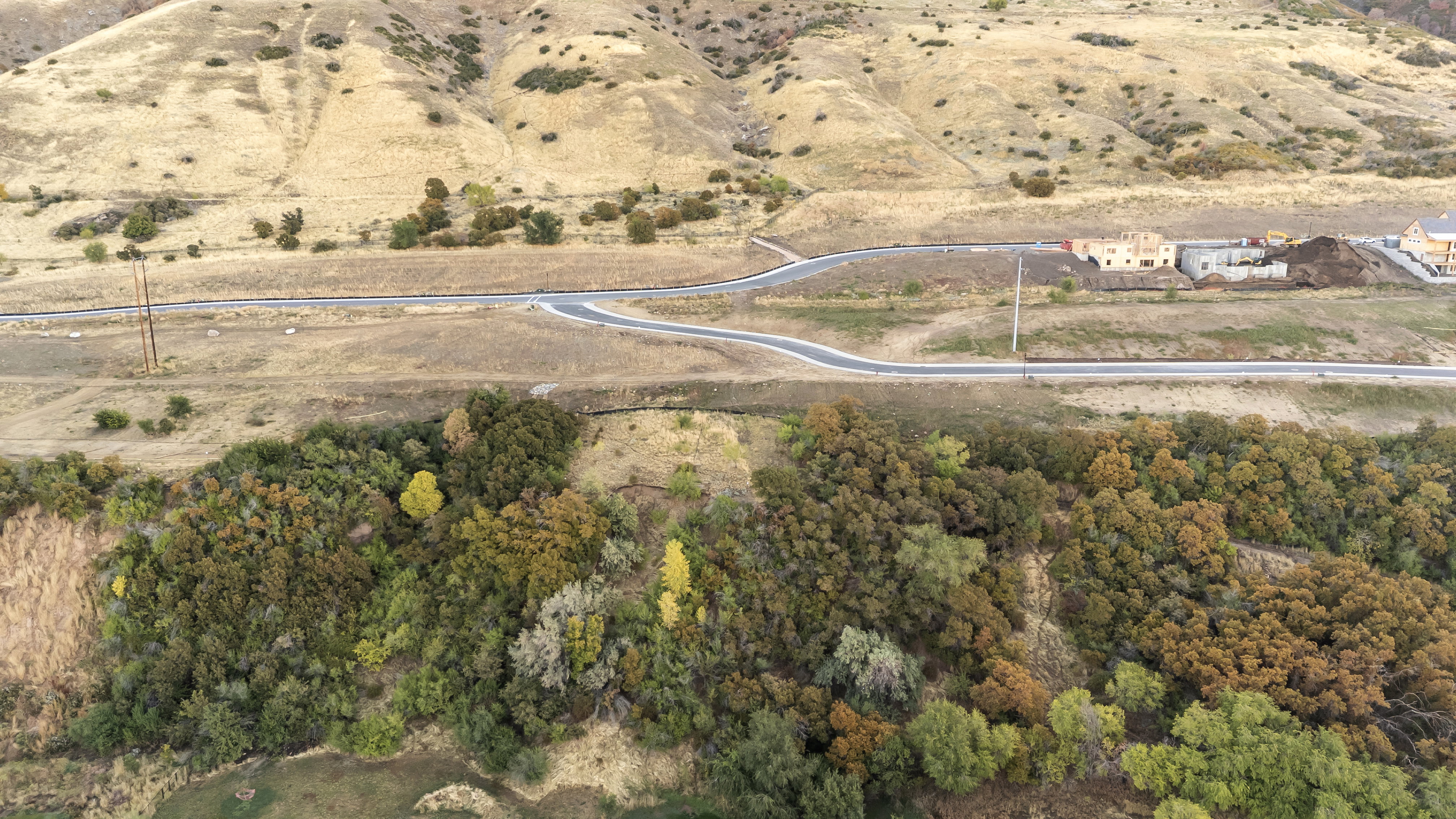 Aerial view of property and surrounding area featuring rural landscape