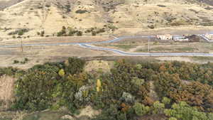 Aerial view of property and surrounding area featuring rural landscape