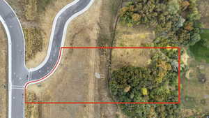 Aerial view of property and surrounding area with property parcel outlined