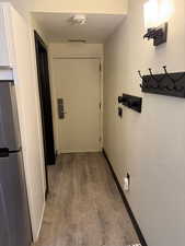 Hallway featuring hardwood / wood-style floors