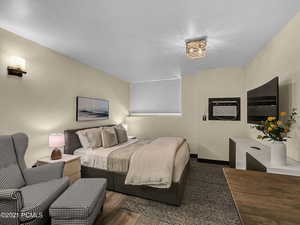 Bedroom featuring dark hardwood / wood-style flooring