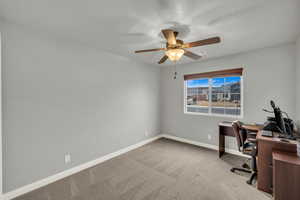 Unfurnished office with carpet and ceiling fan