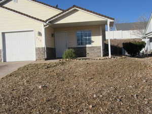 View of front of property featuring a garage