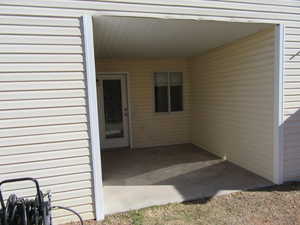 View of patio / terrace with a carport