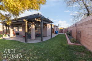 Back of house featuring a private yard, a patio, and a pergola