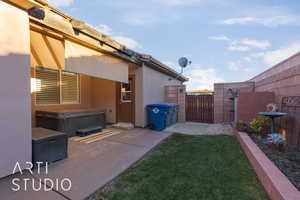 View of yard with a patio and a hot tub