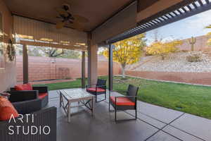 View of very private patio / terrace with ceiling fan and an outdoor hangout area