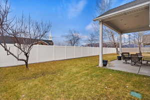 View of yard with a patio