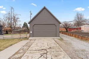 2 car garage with attic space and a large workshop behind it