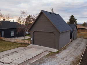 View of garage at dusk