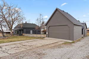 2 car garage with a large workshop behind it