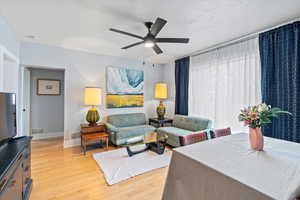 Living room with wood flooring and big windows for a lot of light