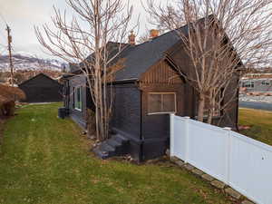 View of home's exterior with a lawn and central air condition unit