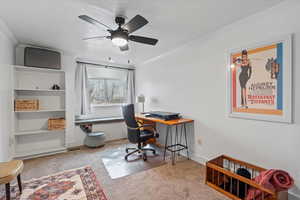 Bedroom 3 - staged as an office. Lots of light and storage bench under window