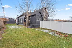 Back of house featuring with fenced yard