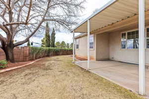 Fenced backyard featuring a patio area