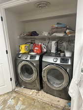 Laundry room featuring washing machine and clothes dryer